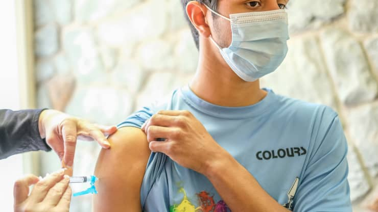 A young man receives his Covid-19 vaccination at a vaccination clinic. People receive the Moderna vaccine in Milford, Pennsylvania.